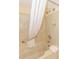 Clean bathroom featuring tub and shower with a white curtain at 1304 N Ocean Blvd. # S-501, Myrtle Beach, SC 29577