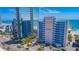 A multi-story resort complex with ocean views and convenient street access and palm trees at 1304 N Ocean Blvd. # S-501, Myrtle Beach, SC 29577