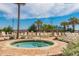 Unwind in the hot tub, amidst palm trees, lounge chairs, and clear skies at 1304 N Ocean Blvd. # S-501, Myrtle Beach, SC 29577