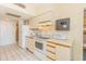 A practical kitchen includes appliances, counter space, and convenient storage at 1304 N Ocean Blvd. # S-501, Myrtle Beach, SC 29577