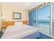 Cozy bedroom with a plush bed and balcony access overlooking the ocean, great view at 1304 N Ocean Blvd. # S-501, Myrtle Beach, SC 29577