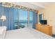 Inviting main bedroom featuring ocean views, a TV, and a dresser for ample storage at 1304 N Ocean Blvd. # S-501, Myrtle Beach, SC 29577