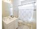 Bright bathroom with a white vanity, mirror, and a combined shower and tub at 1427 Mcmaster Dr., Myrtle Beach, SC 29575
