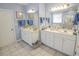 Well-lit bathroom featuring double sinks and ample counter space for storage at 1427 Mcmaster Dr., Myrtle Beach, SC 29575