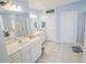 Bright bathroom with a dual sink vanity, shower, and bathtub at 1427 Mcmaster Dr., Myrtle Beach, SC 29575