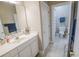 Standard bathroom featuring white vanity and tiled floors with an open doorway to a toilet at 1427 Mcmaster Dr., Myrtle Beach, SC 29575