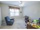 Cozy bedroom with ceiling fan, window, chair, and wooden desk and chair at 1427 Mcmaster Dr., Myrtle Beach, SC 29575
