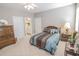 Well-lit bedroom featuring carpeted floor, wood furniture, and a decorative bedspread at 1427 Mcmaster Dr., Myrtle Beach, SC 29575