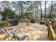 Large wooden deck featuring outdoor furniture, grill, and comfortable seating areas at 1427 Mcmaster Dr., Myrtle Beach, SC 29575