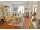 Well-lit dining room featuring hardwood floors, a classic chandelier, and stylish decor at 1427 Mcmaster Dr., Myrtle Beach, SC 29575