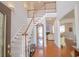 Bright foyer with hardwood floors, featuring a staircase and views into the living areas at 1427 Mcmaster Dr., Myrtle Beach, SC 29575