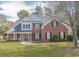 Traditional brick home with manicured lawn and landscaped front yard at 1427 Mcmaster Dr., Myrtle Beach, SC 29575