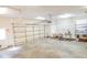 Spacious garage with neutral walls, shelving and a functional garage door at 1427 Mcmaster Dr., Myrtle Beach, SC 29575