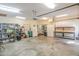 Large garage with workbenches, shelves, fridge and ample storage space at 1427 Mcmaster Dr., Myrtle Beach, SC 29575