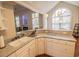 Well-lit kitchen featuring white cabinets and a view into the living room at 1427 Mcmaster Dr., Myrtle Beach, SC 29575