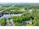 Aerial shot showcasing the home's location near a river, marina, and lush greenery at 154 Harbor Oaks Dr., Myrtle Beach, SC 29588