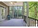 Relaxing screened porch offering views of the surrounding trees and nature at 154 Harbor Oaks Dr., Myrtle Beach, SC 29588