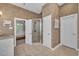 Spacious bathroom with a walk-in shower, tile flooring, and neutral-toned wallpaper at 154 Harbor Oaks Dr., Myrtle Beach, SC 29588