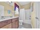 Standard bathroom with a vanity, toilet, and shower-tub combination with a white shower curtain at 154 Harbor Oaks Dr., Myrtle Beach, SC 29588
