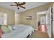 Comfortable bedroom with a TV, ceiling fan, and easy access to the hallway and stairway at 154 Harbor Oaks Dr., Myrtle Beach, SC 29588