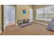 Bedroom featuring natural light, a comfortable lounge area, and neutral decor at 154 Harbor Oaks Dr., Myrtle Beach, SC 29588