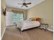 Cozy bedroom featuring a ceiling fan, plush carpet, and a comfortable bed with decorative pillows at 154 Harbor Oaks Dr., Myrtle Beach, SC 29588