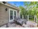 Outdoor deck with patio furniture and a scenic view of the surrounding trees at 154 Harbor Oaks Dr., Myrtle Beach, SC 29588