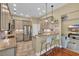 Modern kitchen with granite countertops, stainless steel appliances, and a breakfast bar with seating at 154 Harbor Oaks Dr., Myrtle Beach, SC 29588