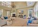 Bright living room with a fireplace, TV, and ample seating, showcasing an open and inviting layout at 154 Harbor Oaks Dr., Myrtle Beach, SC 29588