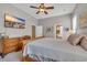 Comfortable main bedroom with neutral colors, wood furniture, and an attached ensuite bathroom at 154 Harbor Oaks Dr., Myrtle Beach, SC 29588