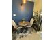 Dining area with seating for two and a decorative shelf at 1851 Colony Dr. # 5M, Surfside Beach, SC 29575