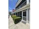 Condominium exterior features a screened patio and well-manicured landscaping at 1851 Colony Dr. # 5M, Surfside Beach, SC 29575