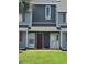 Close up of front door to unit with green lawn and yellow curb at 1851 Colony Dr. # 5M, Surfside Beach, SC 29575