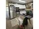 Bright kitchen features white cabinetry, stainless steel appliances, and beachy decor at 1851 Colony Dr. # 5M, Surfside Beach, SC 29575