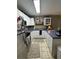 Bright kitchen features white cabinetry, stainless steel appliances, and modern lighting at 1851 Colony Dr. # 5M, Surfside Beach, SC 29575