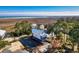 Aerial view of raised homes on marsh, featuring stunning views of the ocean at 189 Brown Pelican Loop, Pawleys Island, SC 29585