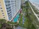 Aerial view showcases pool with lounge chairs, a building, beach access, and beautiful scenery at 2000 N Ocean Blvd. # 1206, Myrtle Beach, SC 29577