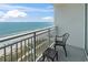 Charming balcony seating area provides gorgeous ocean views, perfect for enjoying the coastal breeze at 2000 N Ocean Blvd. # 1206, Myrtle Beach, SC 29577