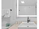 Bright bathroom featuring a modern sink, illuminated mirror, and neatly arranged white towels at 2000 N Ocean Blvd. # 1206, Myrtle Beach, SC 29577
