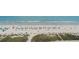 Beautiful beach view with colorful umbrellas, soft sand, and refreshing ocean waters at 2000 N Ocean Blvd. # 1206, Myrtle Beach, SC 29577