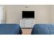 Bedroom featuring a TV on a dresser, with two beds in the foreground at 2000 N Ocean Blvd. # 1206, Myrtle Beach, SC 29577