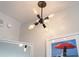 Chandelier hangs from the ceiling above the mirror and framed art at 2000 N Ocean Blvd. # 1206, Myrtle Beach, SC 29577