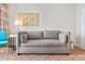 Cozy living room featuring a grey couch, decorative wall art, and accent furniture at 2000 N Ocean Blvd. # 1206, Myrtle Beach, SC 29577