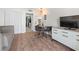 Cozy living room view shows a dining table, a closet, and a television at 2000 N Ocean Blvd. # 1206, Myrtle Beach, SC 29577