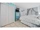 Well-lit bedroom featuring a queen bed, dresser, and closet space at 2001 S Ocean Blvd. # 920, Myrtle Beach, SC 29577