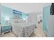 Light and airy bedroom with a queen bed, dresser, and decorative artwork at 2001 S Ocean Blvd. # 920, Myrtle Beach, SC 29577