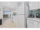 Compact kitchen with white appliances and cabinets at 2001 S Ocean Blvd. # 920, Myrtle Beach, SC 29577