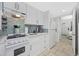 Efficient kitchen with white cabinetry, appliances, and modern countertops at 2001 S Ocean Blvd. # 920, Myrtle Beach, SC 29577