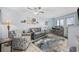 Comfortable living room with sofa, armchair, tiled floor, and beach decor at 2001 S Ocean Blvd. # 920, Myrtle Beach, SC 29577