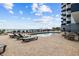 Outdoor pool area with lounge chairs at a condo resort near the ocean at 2001 S Ocean Blvd. # 920, Myrtle Beach, SC 29577